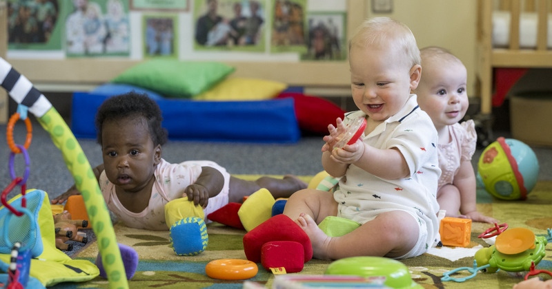 Infants play with blocks, balls and other colorful toys in CEHD’s Early Learning Center.