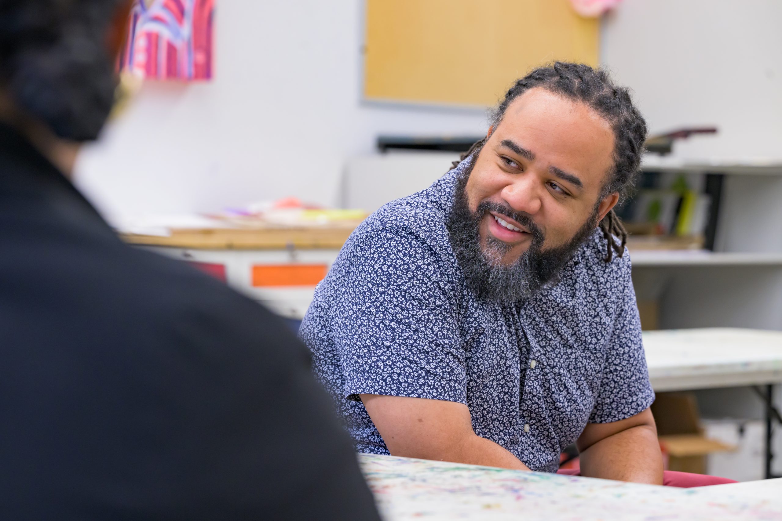 Roderick. L. Carey, CEHD associate professor, works with Delaware high school students at the Delaware Art Museum.