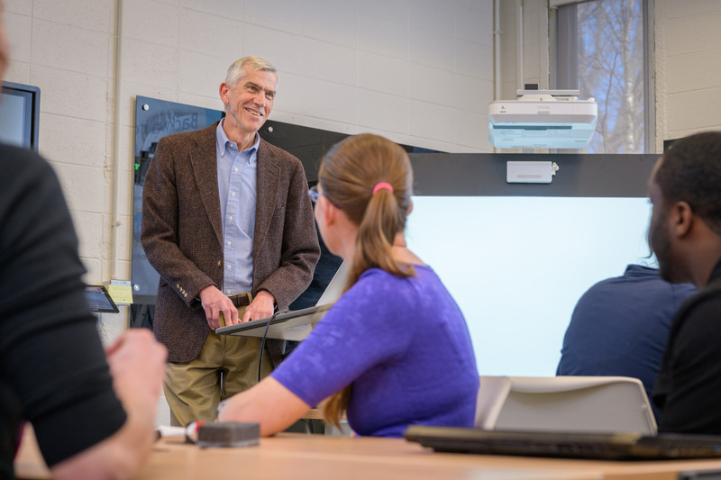 James Hiebert, professor emeritus in UD’s College of Education and Human Development, talks with mathematics education doctoral students during a graduate seminar.